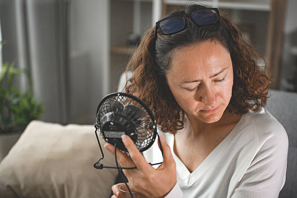 woman suffering from heatstroke at home
